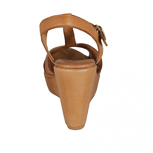 Woman's sandal with strap in cognac brown leather wedge heel