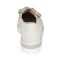 Woman's highfronted shoe with tassels and elastics in creme-colored pierced leather wedge heel 4 - Available sizes:  43, 44, 45, 46