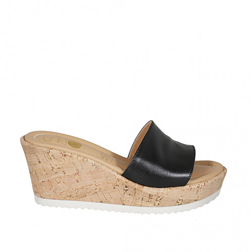 Woman's mules in black leather wedge...