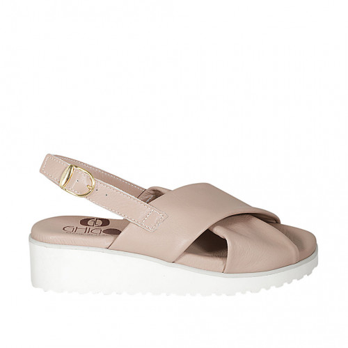 Woman's sandal in nude leather wedge...