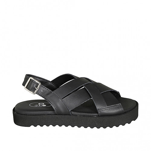 Woman's sandal in black leather wedge...