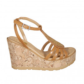 Woman's strap sandal in cognac leather with golden studs and platform and wedge heel 9 - Available sizes: 33, 34