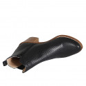Woman's ankle boot with zipper and elastic band in black pierced leather with heel 7 - Available sizes:  42