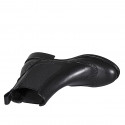 Woman's ankle boot in black leather with elastic bands and wingtip heel 3 - Available sizes:  32, 45