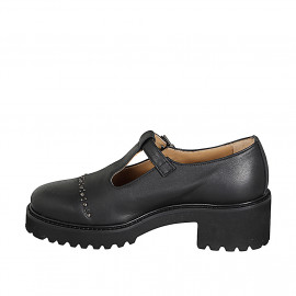Woman's closed shoe with a T-strap and studs in black leather heel 5 - Available sizes:  32, 33, 34, 42, 43, 44, 45, 46 2