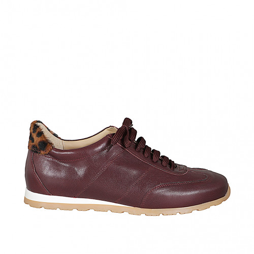 Woman's lace-up sneakers with a...