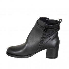 Woman’s black leather ankle... 2