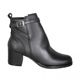 Woman’s black leather ankle...