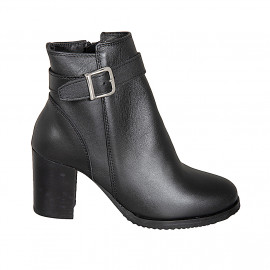 Woman’s black leather ankle...