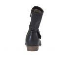 Woman's boot with buckle in black pierced leather  - Available sizes:  32