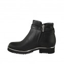 Woman's ankle boot in black leather with buckle and zipper heel 3