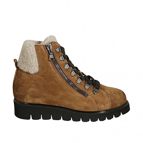 Woman s laced ankle boot in tan brown suede with zipper and fur