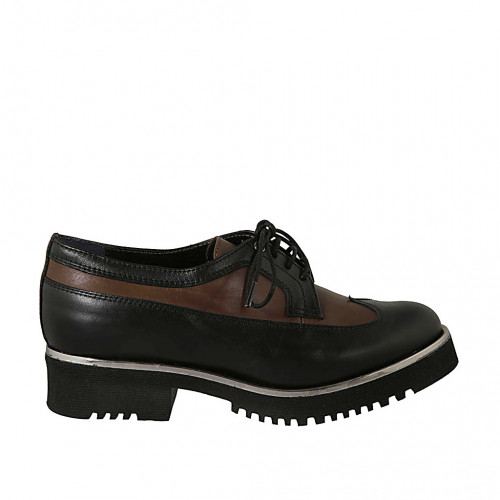 Woman's laced derby shoe with wingtip in black and brown leather heel 3 - Available sizes:  43