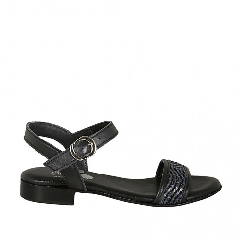 Woman's strap sandal in black pierced...