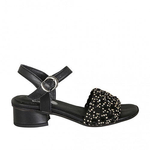 Woman's strap sandal with studs in...