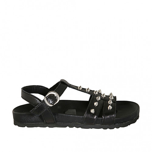 Woman's strap sandal with studs in...